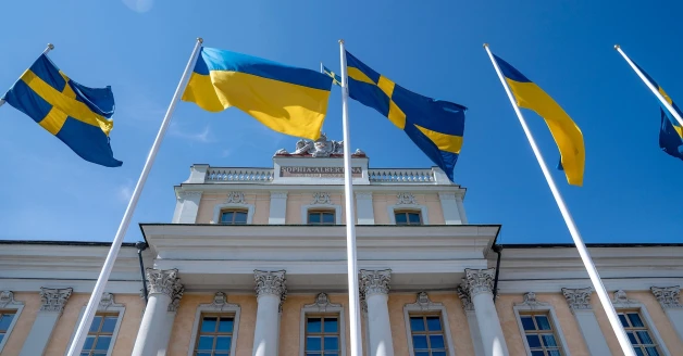 Foreign embassy building with Ukrainian and EU flags in Kyiv