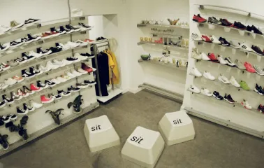 A wall with a large selection of sneakers in the Konyk.dept store in Kyiv