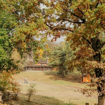 Pyrohiv Museum in Kyiv - hillside view of traditional buildings and trees