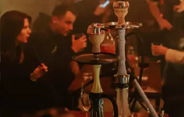 Vugol na Arsenalnii - guests smoking hookah at lounge table
