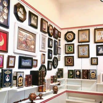 Folkmart in Kyiv - display of traditional Ukrainian souvenirs including religious icons and historical literature