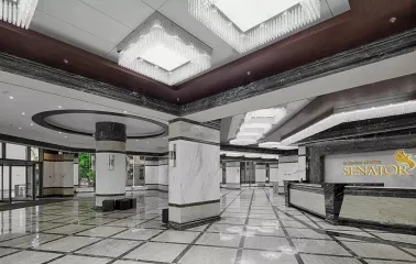 Senator Business Center in Kyiv - marble lobby hall with large square chandeliers