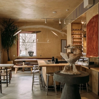 One Tea Tree - minimalist wooden interior with low seating, peaceful atmosphere