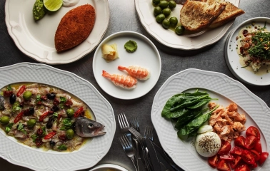 Fish Fetish - close-up view of a plated seafood dish with fish and fresh garnish