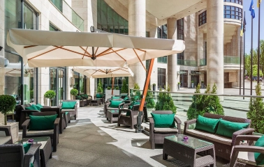 Hilton Kyiv - comfortable outdoor terrace seating area on a sunny day