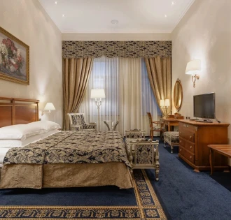 Room with a double bed at the Premier Palace Hotel in Kyiv, decorated in a classic style
