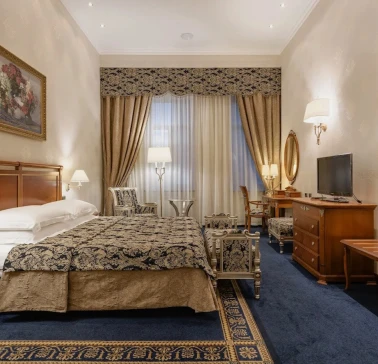 Room with a double bed at the Premier Palace Hotel in Kyiv, decorated in a classic style