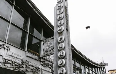 A vertical sign with the name "Zhytniy Market" on the facade of a building in Kyiv