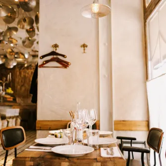 Fish Pussycat - spacious dining area with modern lighting and casual wooden furniture