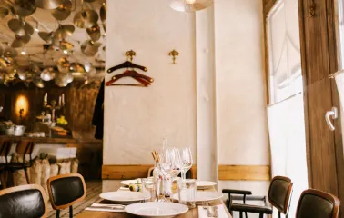 Fish Pussycat - spacious dining area with modern lighting and casual wooden furniture