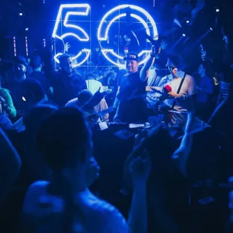Party at the Fifty club in Kyiv with a lot of people and blue lighting