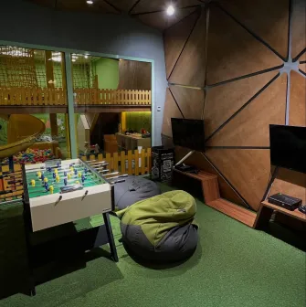 Cafe "Pesto" - children's play area with toys, a console and table football