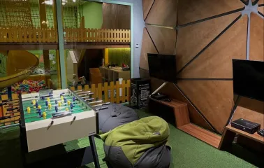 Cafe "Pesto" - children's play area with toys, a console and table football