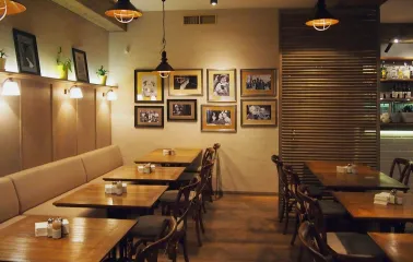 Restaurant Very Well Cafe - spacious dining hall interior with varied seating and large light fixtures