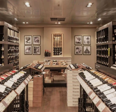 Goodwine in Kyiv - rows of wine bottles on shelves and wall pictures