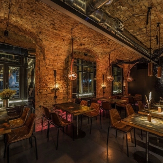 Winbar - view of the bar counter area with shelves filled with bottles and wine glasses