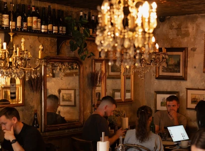 Cozy dining area at Mimosa Brooklyn Pizza restaurant in Kyiv with vintage decor