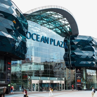Ocean Plaza in Kyiv - striking modern exterior architecture featuring a wavy dark blue glass facade