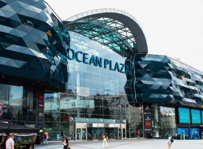Ocean Plaza in Kyiv - striking modern exterior architecture featuring a wavy dark blue glass facade