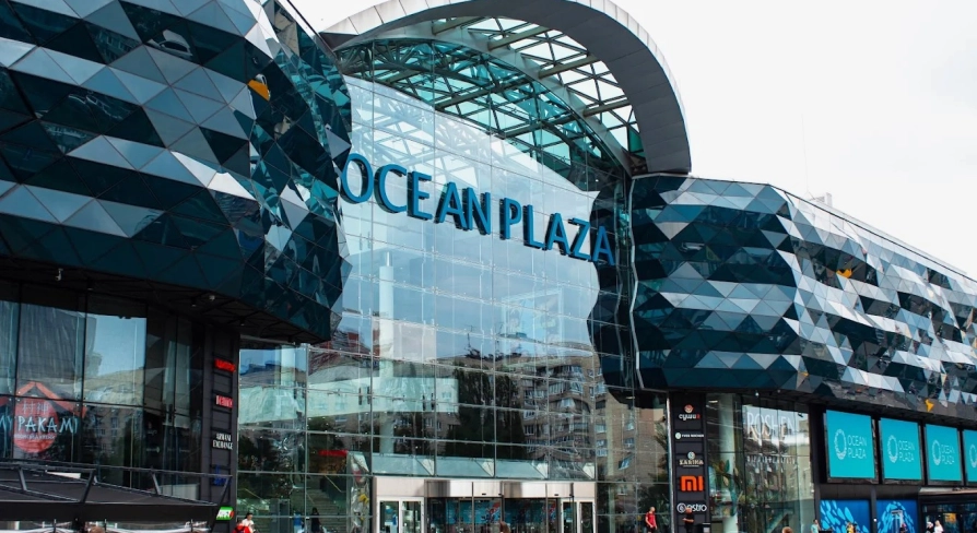 Ocean Plaza in Kyiv - striking modern exterior architecture featuring a wavy dark blue glass facade