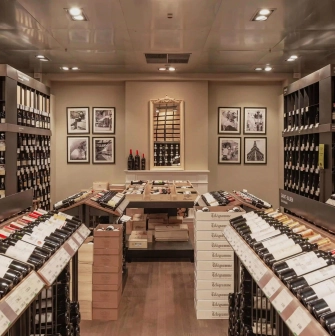 Goodwine in Kyiv - rows of wine bottles on shelves and wall pictures