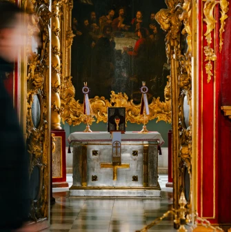 St. Andrew's Church in Kyiv - altar table with cross seen through open royal doors
