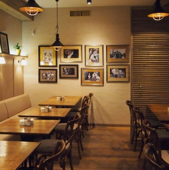 Restaurant Very Well Cafe - spacious dining hall interior with varied seating and large light fixtures