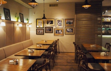 Restaurant Very Well Cafe - spacious dining hall interior with varied seating and large light fixtures