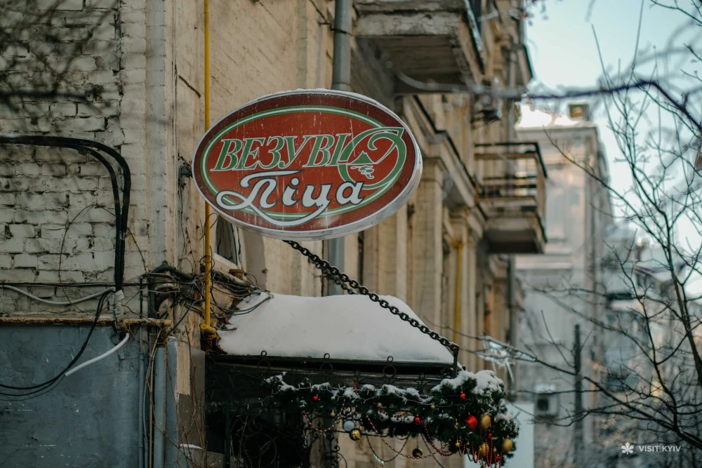 Sign of Vezuvio pizza on the building