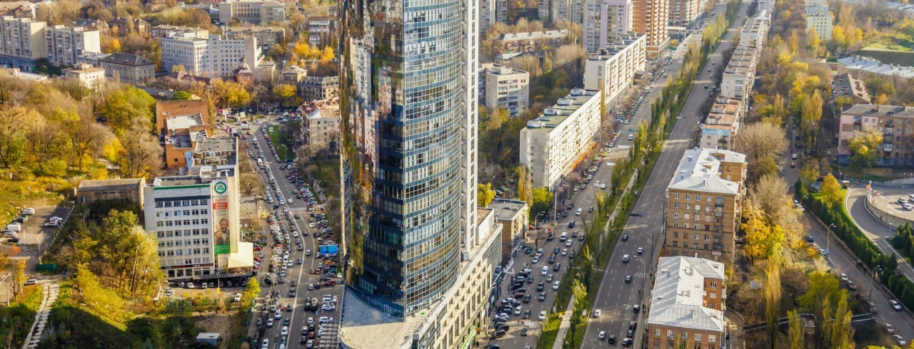 Parus Business Centre in Kyiv - tall glass skyscraper rising above busy city streets