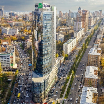 Parus Business Centre in Kyiv - tall glass skyscraper rising above busy city streets