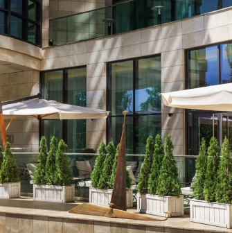 Hilton Kyiv - elegant restaurant terrace with tables and panoramic city view