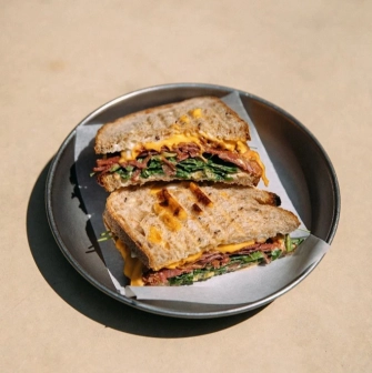 One Tea Tree - grilled sandwich with cheese, meat and greens