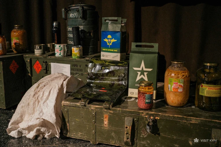 Museum exhibition displaying captured Russian military rations and ammo crates in Kyiv