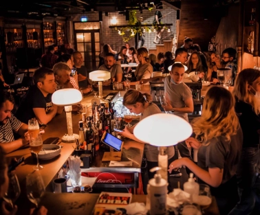 Pab Kedy - busy bar counter with bartenders serving drinks to many guests