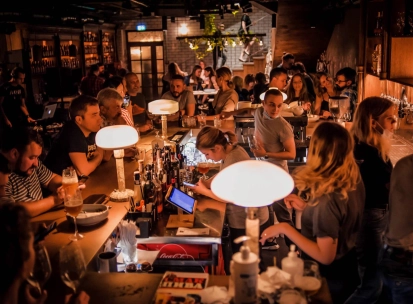 Pab Kedy - busy bar counter with bartenders serving drinks to many guests