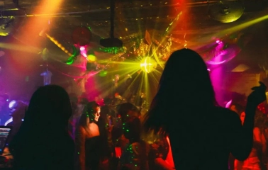 Vechirochka - nightclub crowd under pink and yellow stage lights