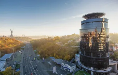 IQ Business Center in Kyiv - round glass facade of a business center with a view of Kyiv