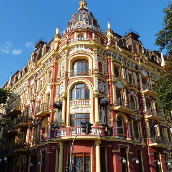Syrotkin House - grand red and yellow corner house with ornate baroque decorations