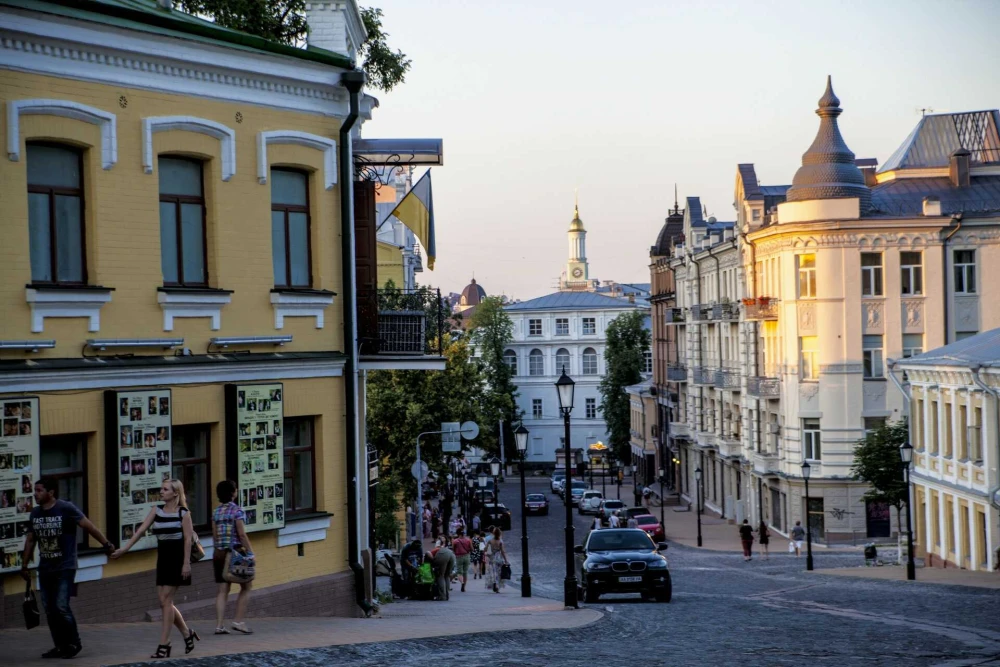View of Andriyivskyi Descent in Kyiv with cobblestone road and historic buildings