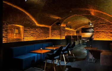 Loggerhead - cozy, dimly lit interior with unique archways and soft wall textures