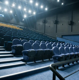 Blue seats in the Multiplex cinema hall with LED lighting