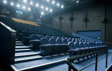Blue seats in the Multiplex cinema hall with LED lighting
