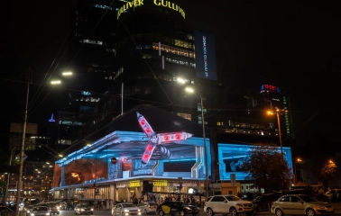Gulliver shopping center in Kyiv at night with bright lights and a video screen