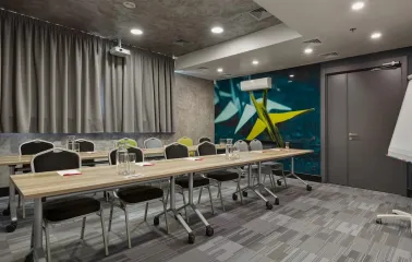 Ibis Kyiv City Center in Kyiv - meeting room with long tables and wall paintings