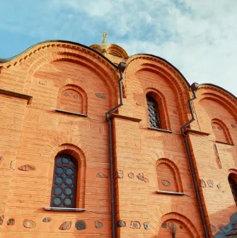 Golden Gate in Kyiv - close-up view of the red brick upper facade with arched niches and decorative stone details