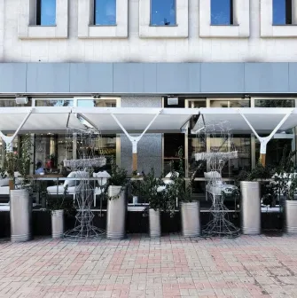 Holy Burger - facade with signage and large windows overlooking the street