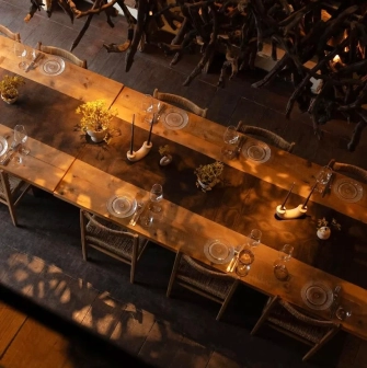 Seliam in Kyiv - view from above at banquet table with candles and branch decor