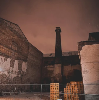 Exterior of K41 club in Kyiv: old brick building at night
