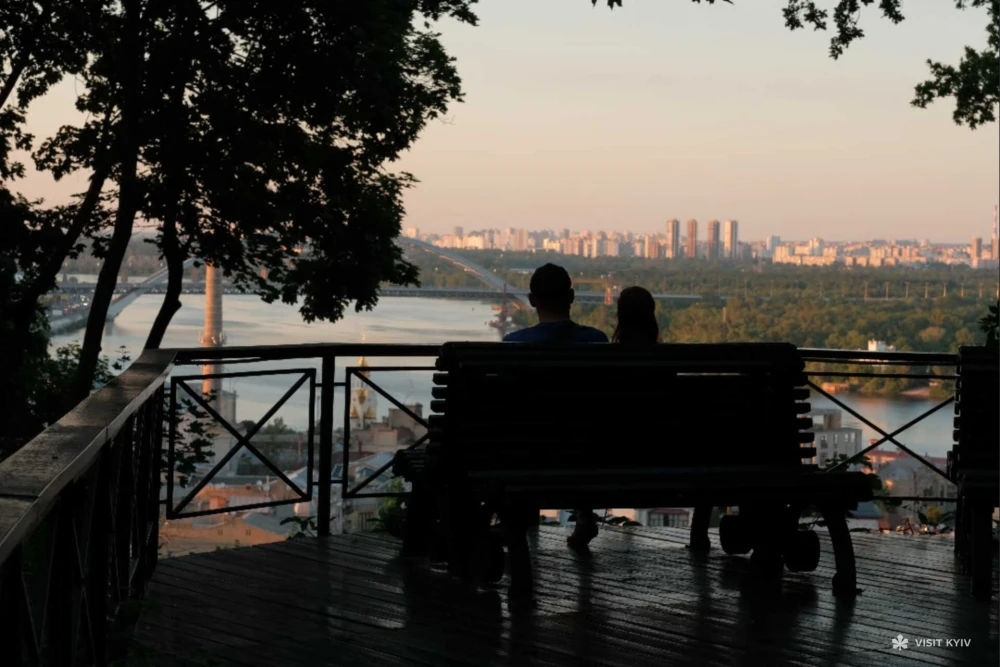 Couple watching the sunset on Vladimirskaya Hill